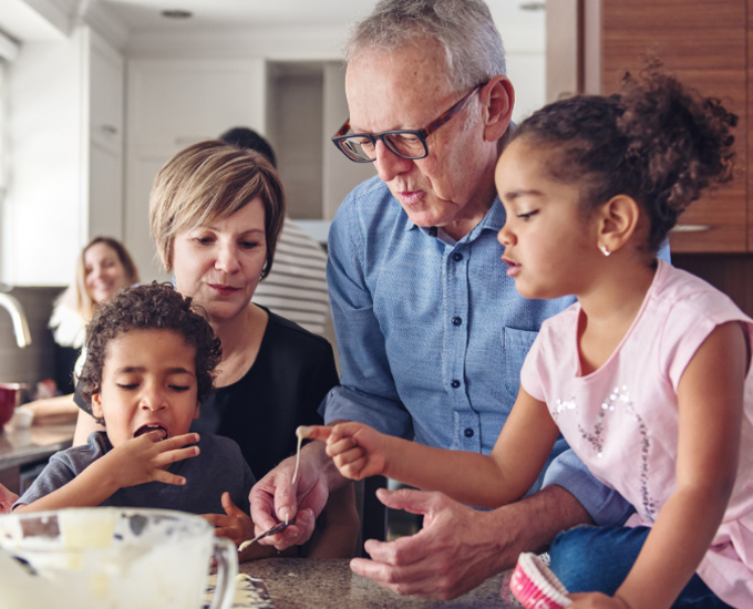 Grandparents bake with their grandkids. Estate and Trust Law at Bosshard Parke, La Crosse, WI.