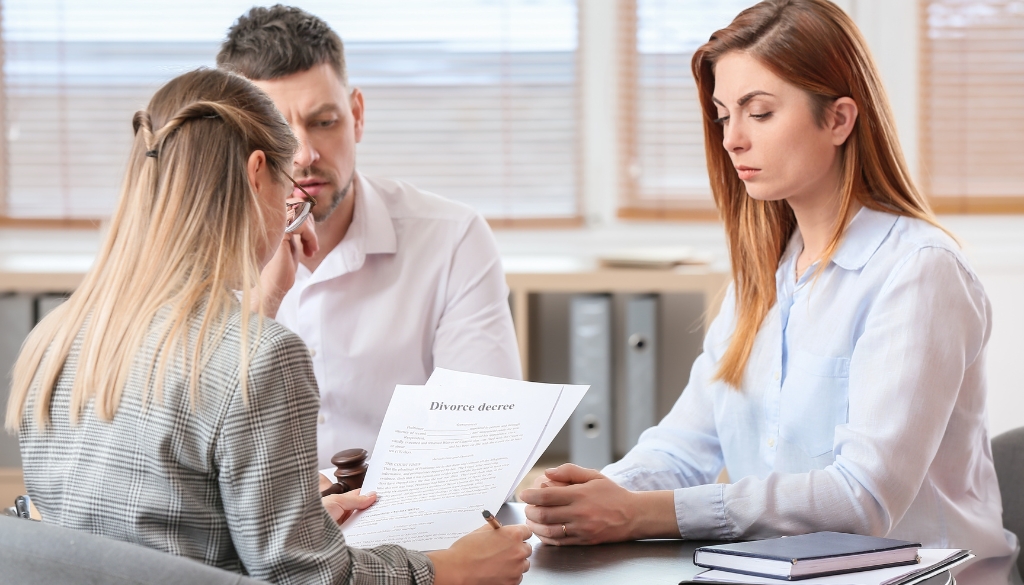 A couple meeting with a divorce attorney.