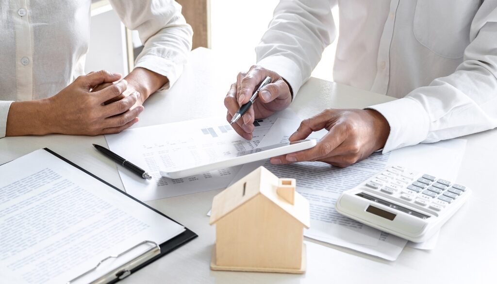 People filling out estate planning legal paperwork.