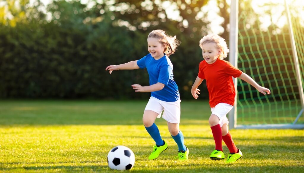 Two kids kicking around a soccer ball in La Crosse, Wisconsin.