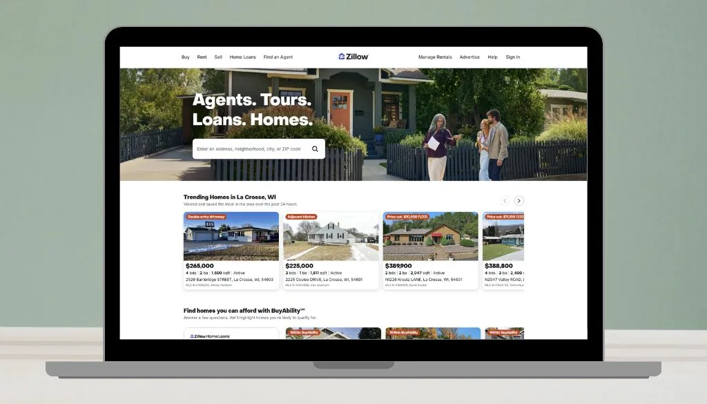 Zillow homepage displayed on a laptop, showcasing trending home listings in La Crosse, WI.