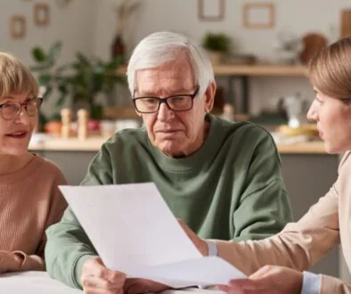 An elderly couple reviewing a document with an experienced estate planning attorney.