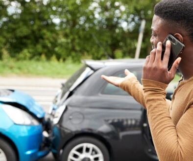 bosshard-parke-unisured-underinsured-motorist-coverage-car-crash-man-on-phone