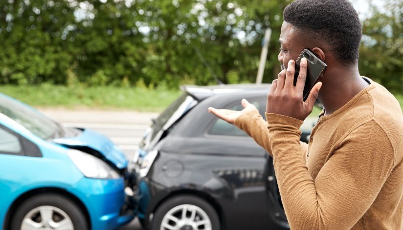 bosshard-parke-unisured-underinsured-motorist-coverage-car-crash-man-on-phone