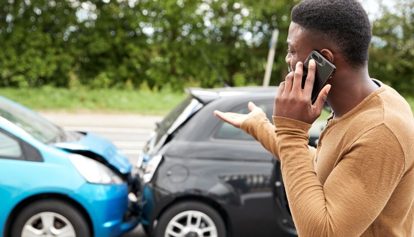 bosshard-parke-unisured-underinsured-motorist-coverage-car-crash-man-on-phone